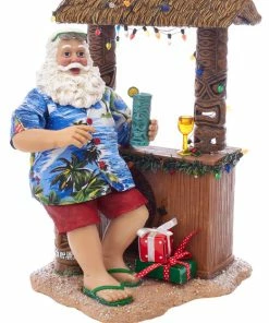 Best Pirce 💯 Kurt S. Adler, Inc. Kurt Adler 11" Fabriche Beach Santa Sitting At Tiki Bar 🧨